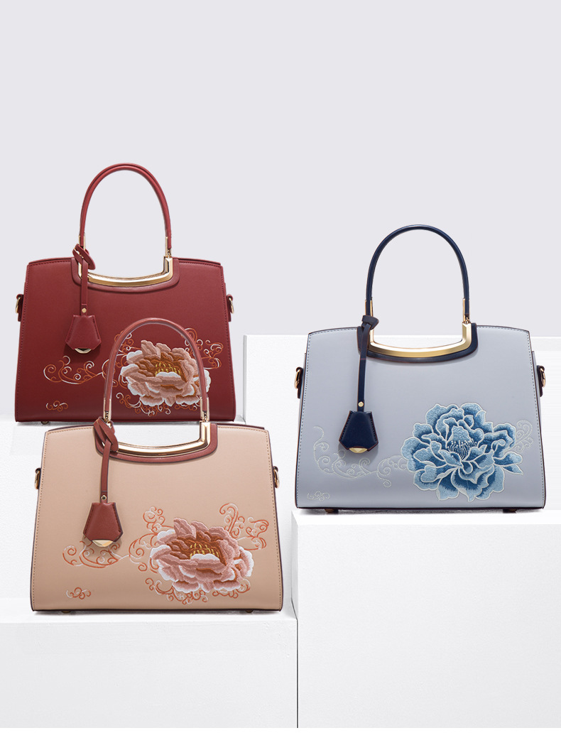 Ladies Elegant Burgundy Handbag with Floral Embroidery And Gold-Tone Hardware